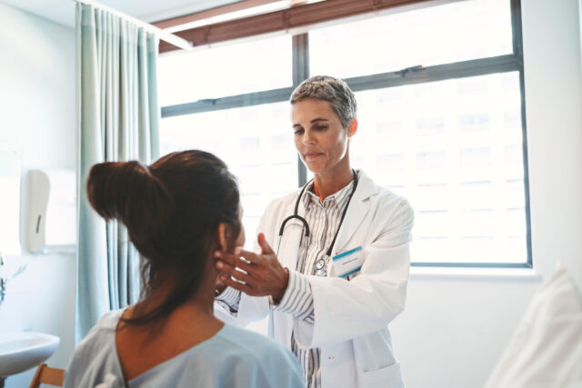 photo - Doctor Examining Patient