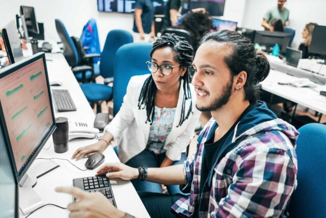 photo - Young Business Team Using Computer in Office